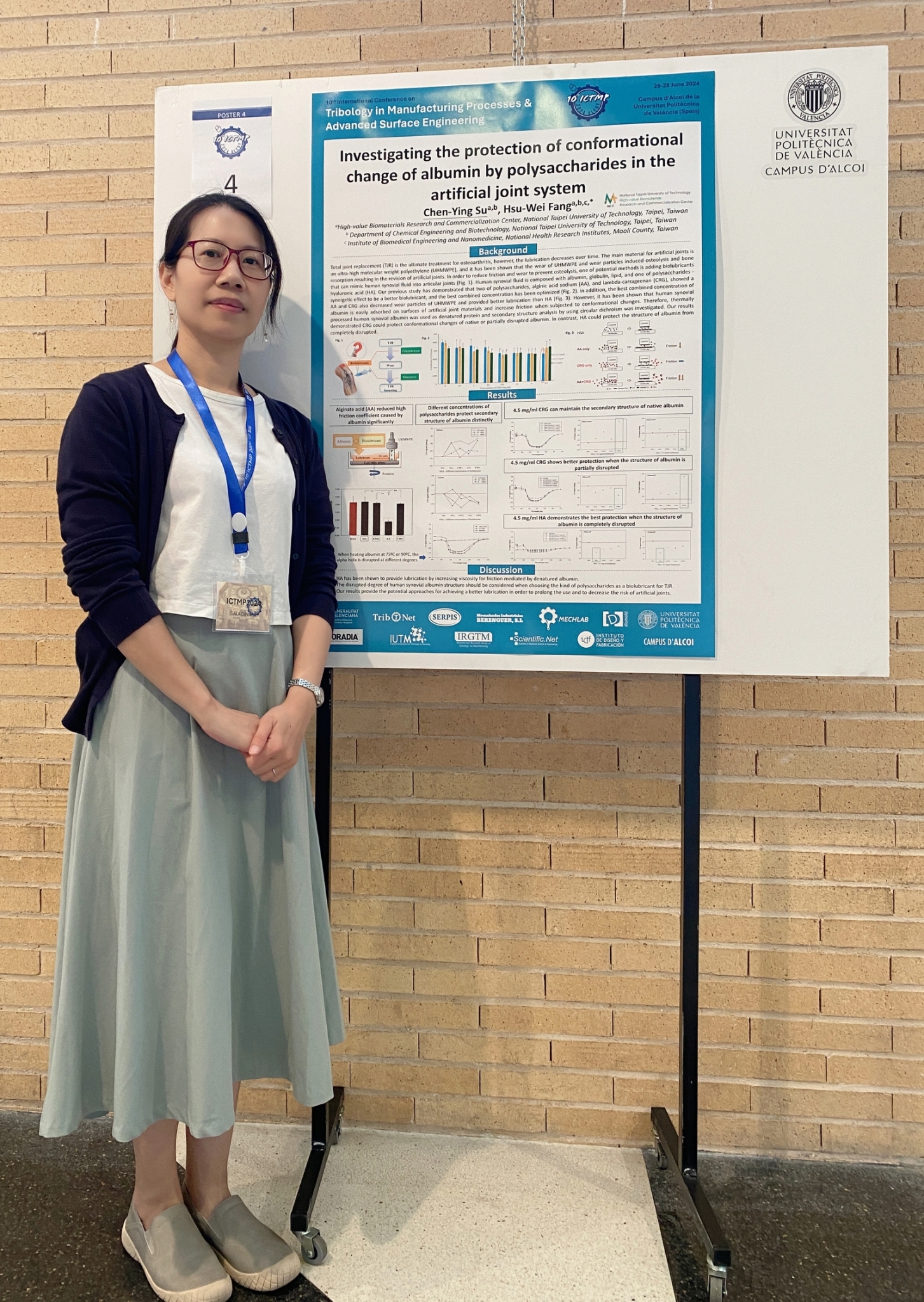 Assistant Research Professor Chen-Ying Su poses for a photo with her research poster.