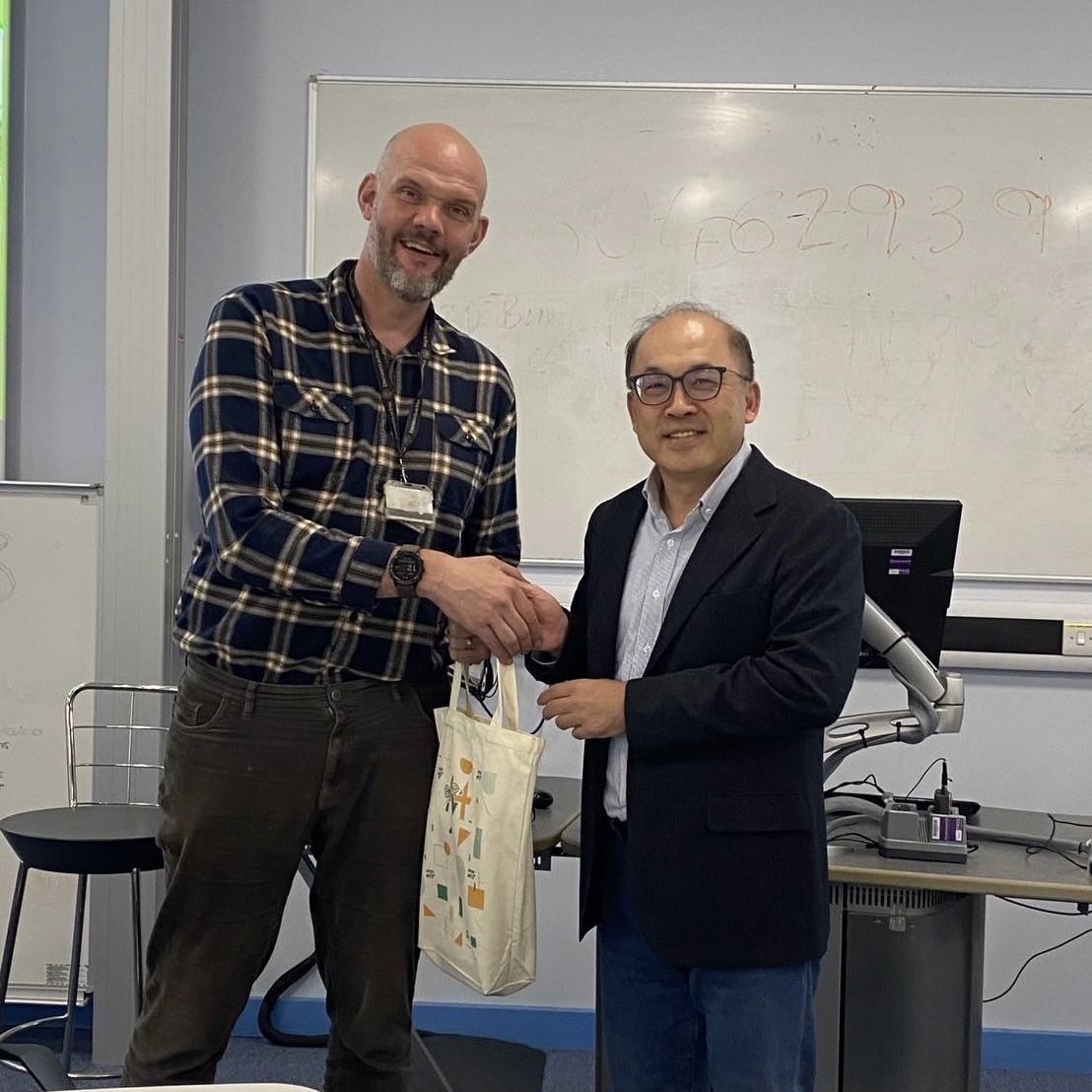 Professor Hsu-Wei Fang poses for a photo with Prof. Liam Grover, Director of the benchmark center.
