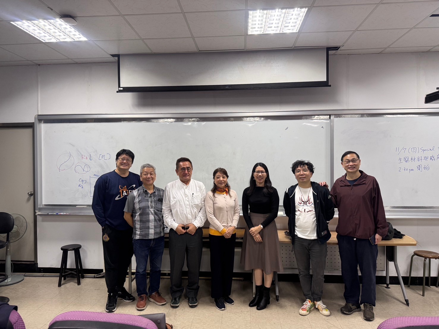 Dr. Kazuo Sakurai and Dr. Madoka Takai pose for a group photo with members of the Center.