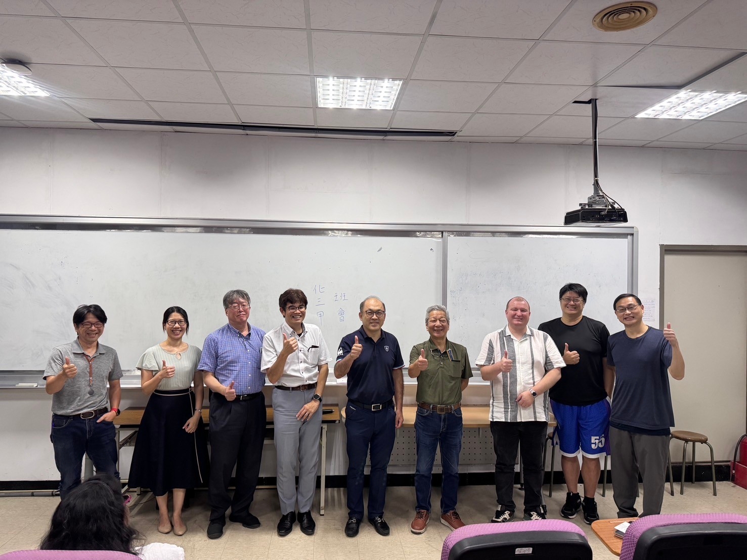 Dr. Naoki Matsuda and Dr. Kishimura pose for a group photo with members of the Center.