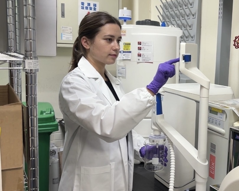 International exchange student Justina operates laboratory equipment