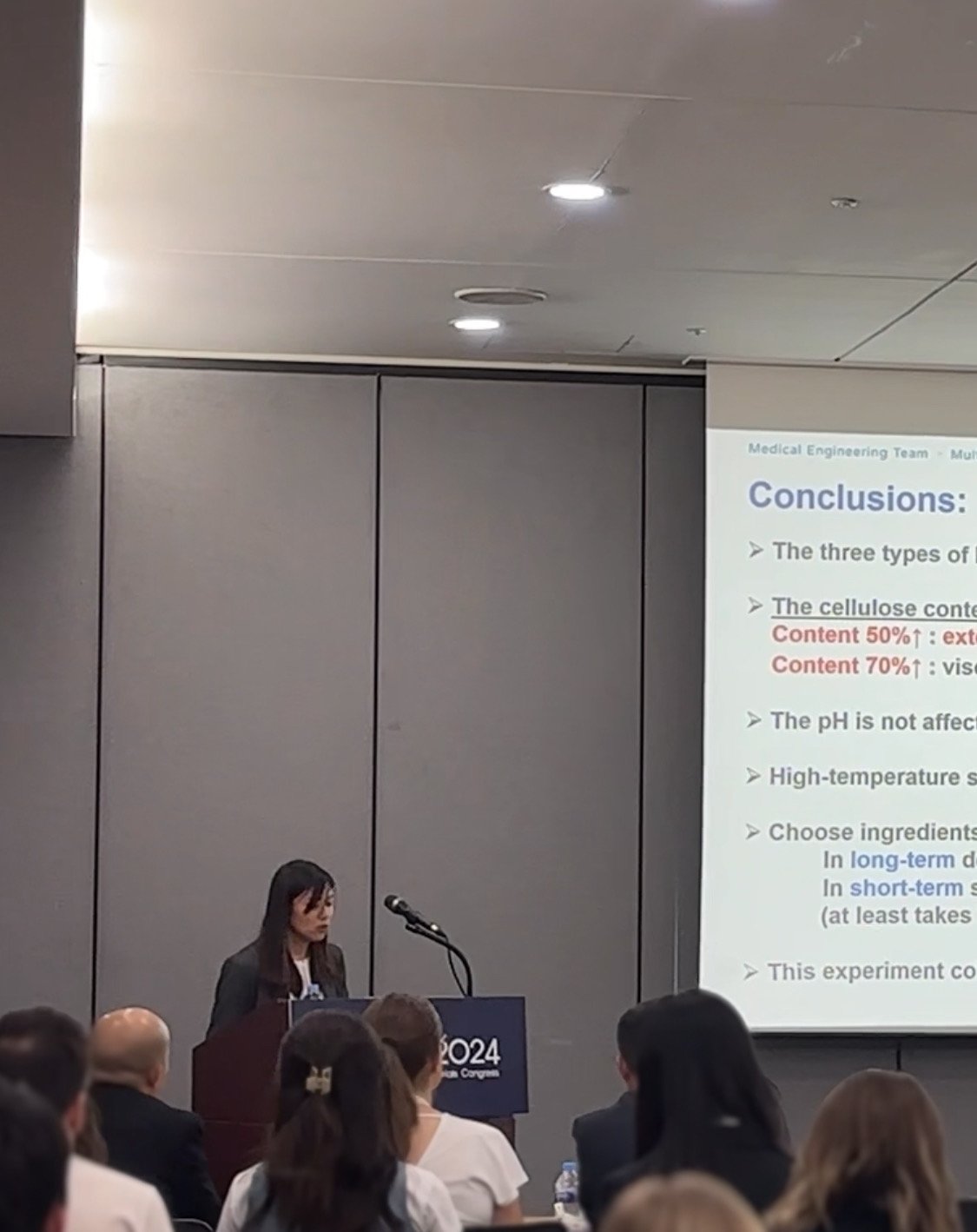 Postdoctoral Researcher Liu I-Hsin giving a presentation on stage