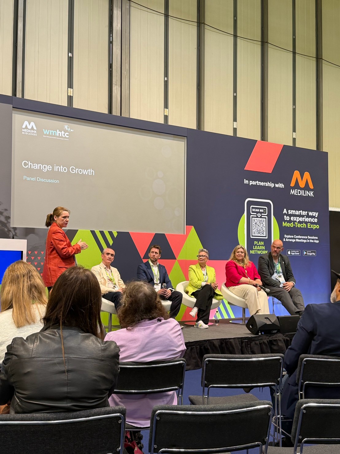 Attending a conference session at the exhibition