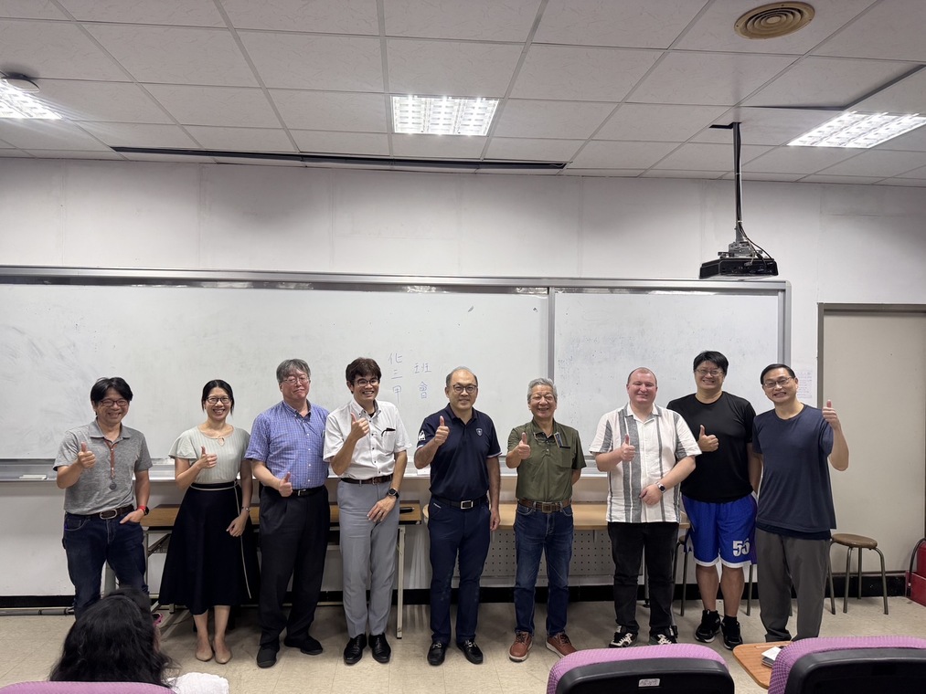 Prof. Yukio Nagasaki poses for a group photo with faculty members from the Center