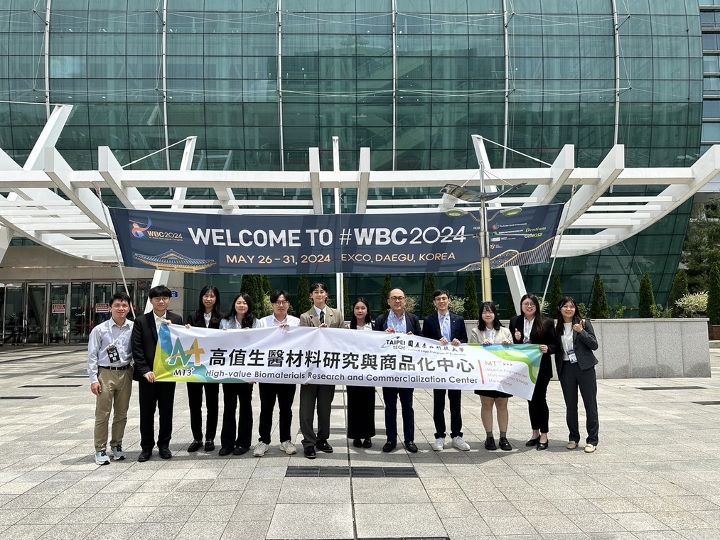 Group photo of all participants holding the Center’s banner outside the venue.